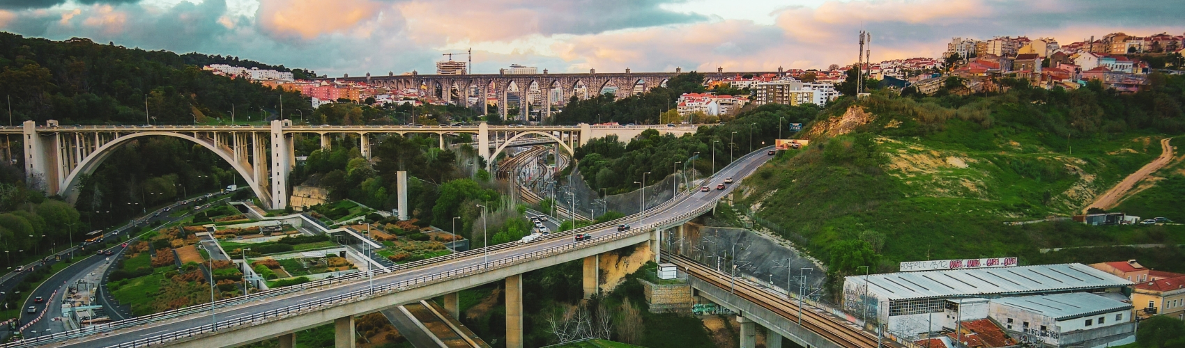 Aerial images, top shot, of roads, viaducts and trains in the city of Lisbon