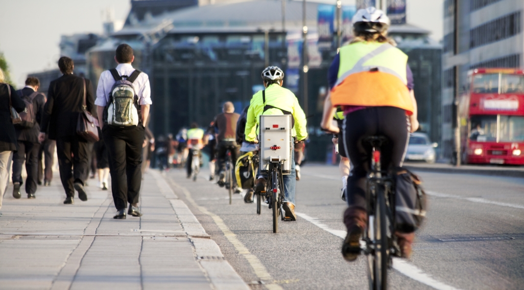 cyclists in cycle lane on side of the road