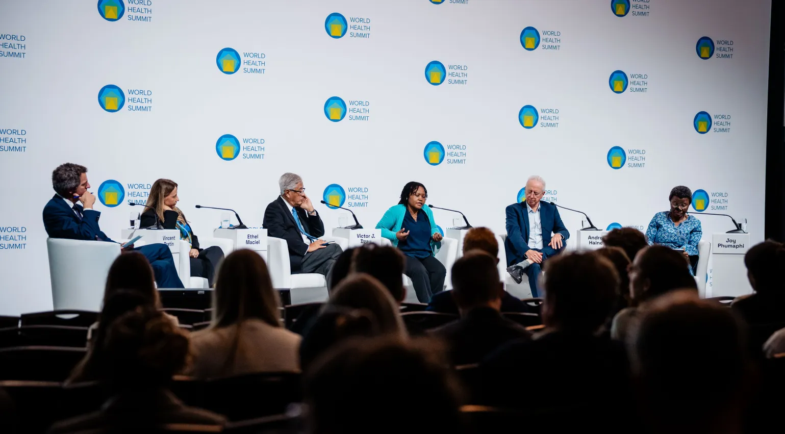 Photograph of panellists on stage at the World Health Summit in Berlin